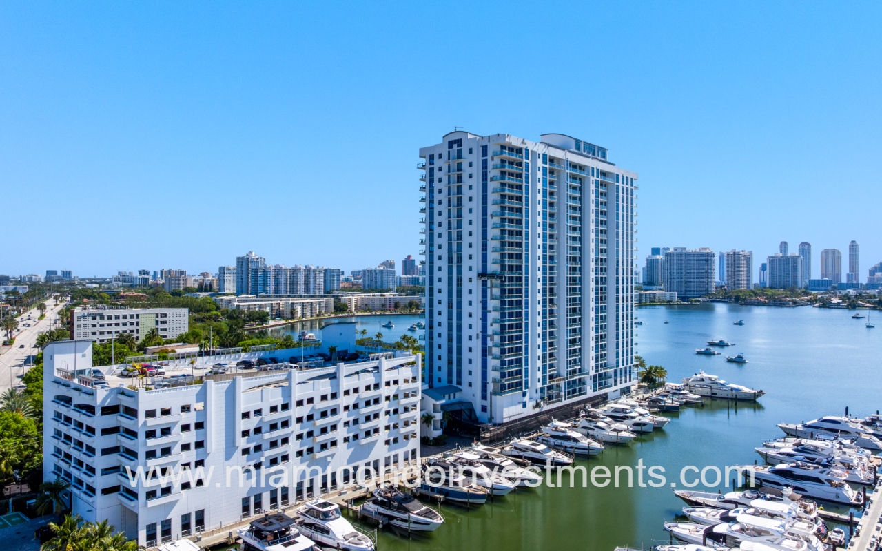 Marina Palms North drone facing northward with condo building and parking garage