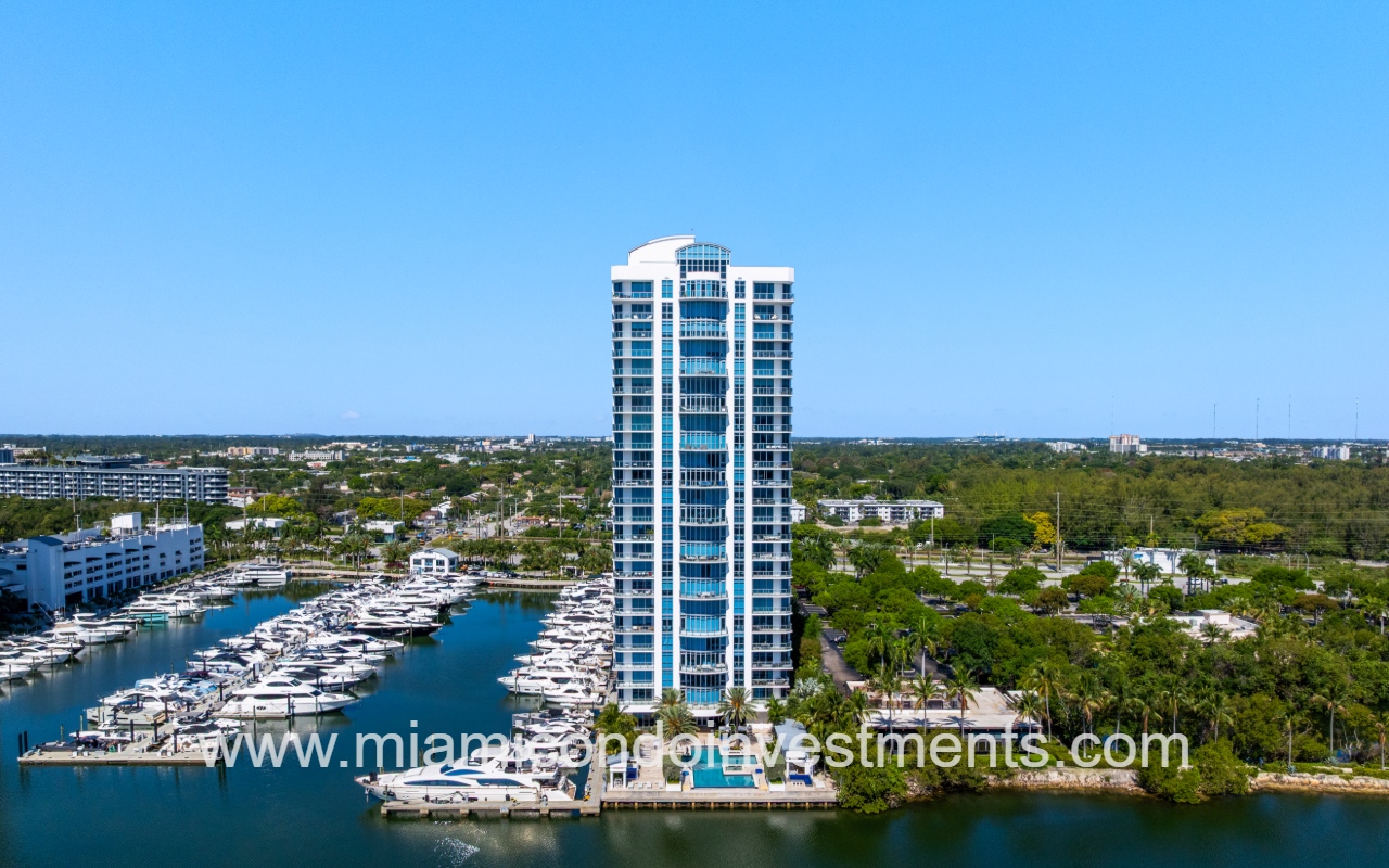 Marina Palms North drone directly facing condo building from above waterway