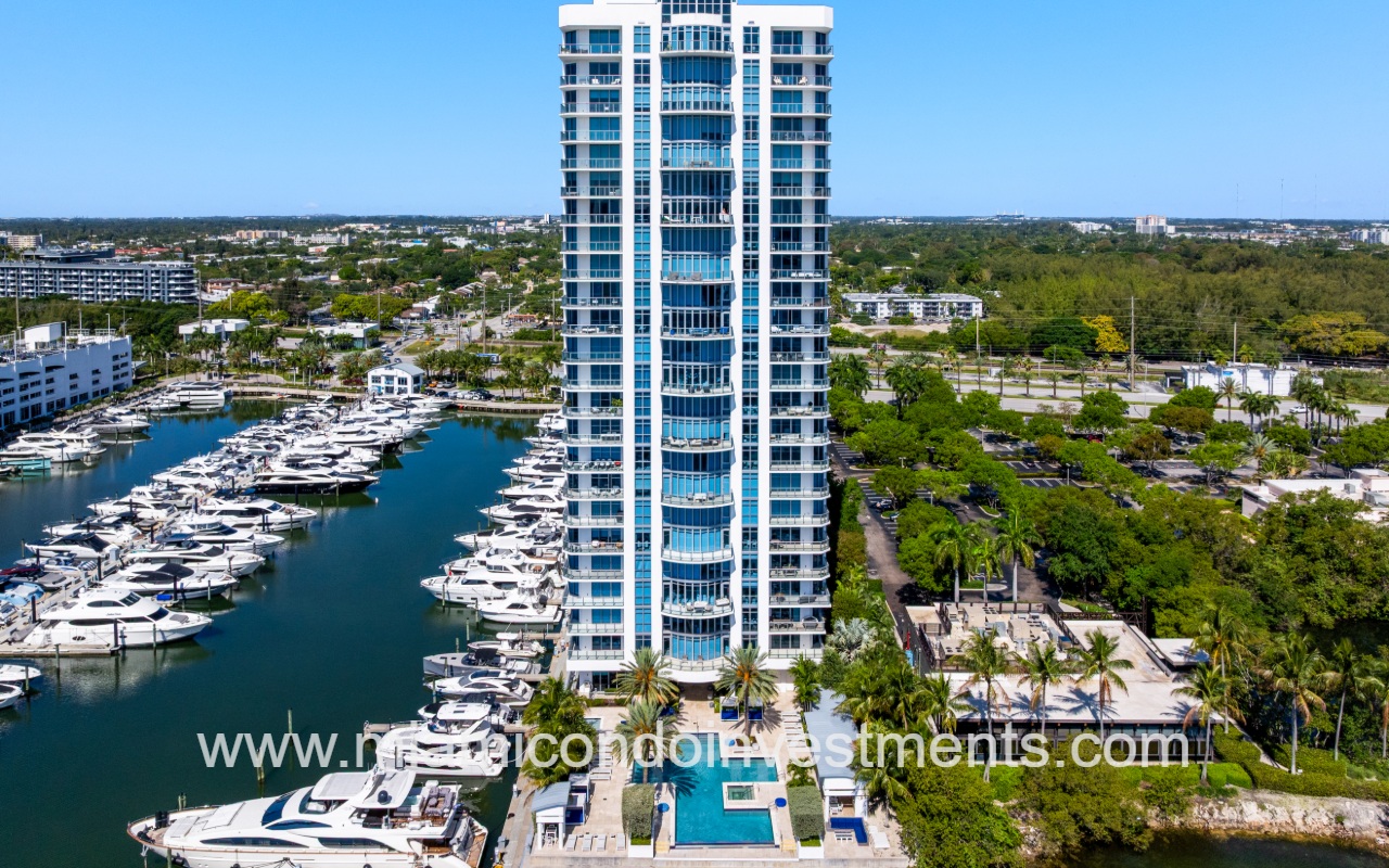 Marina Palms North drone closeup directly facing condo building from above waterway