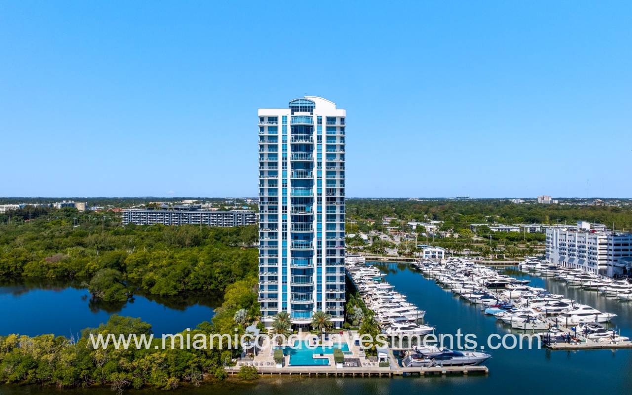 Marina Palms South drone view directly facing condo building and pool from above waterway