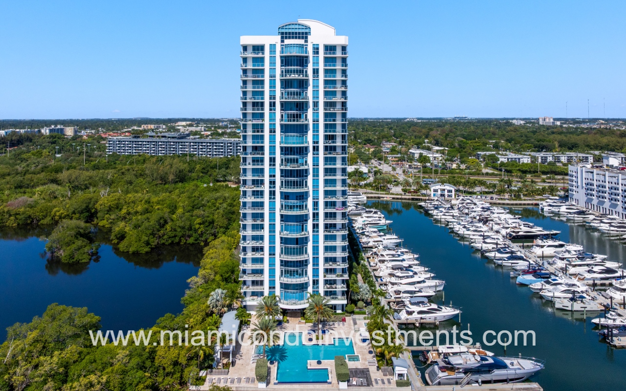 Marina Palms South drone view closeup directly facing condo building and pool from above waterway