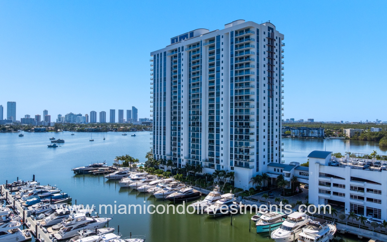 Marina Palms South drone view angle facing side of condo building with boats parked