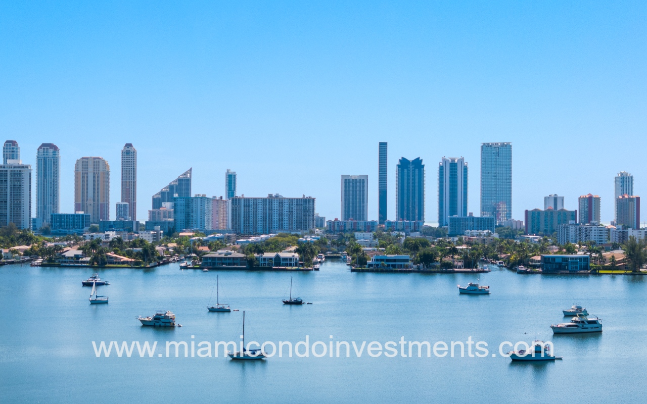 Marina Palms South drone view closeup of lake with boats and building skyline