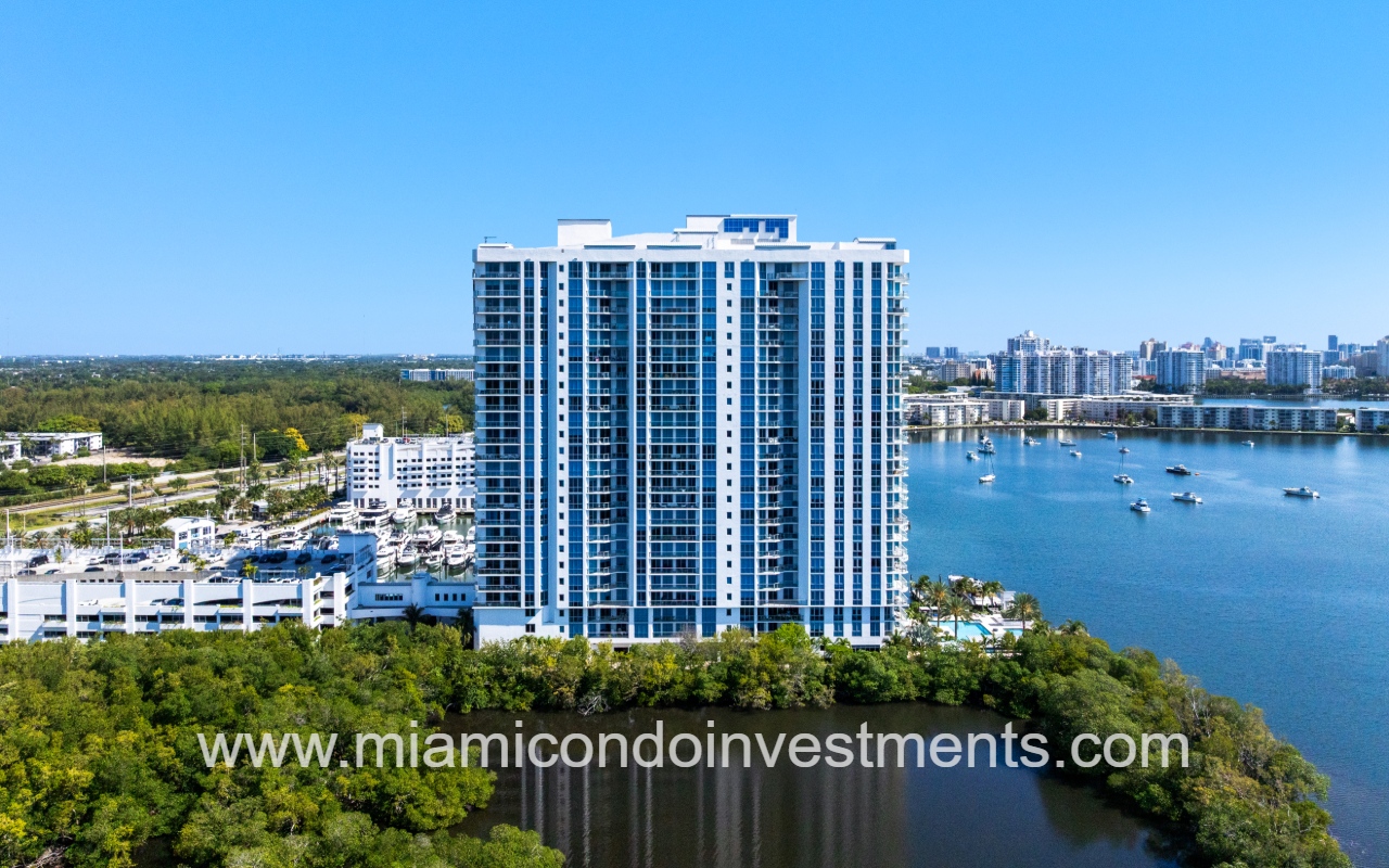 Marina Palms South drone angle view of condo building with boats parked